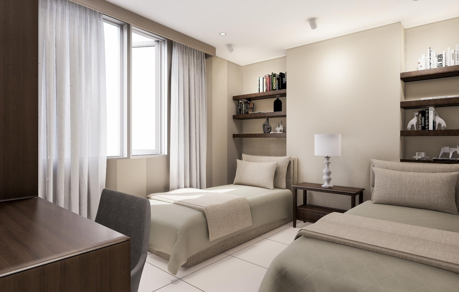  A spacious bedroom with two beds and a desk, ideal for sharing or accommodating guests.