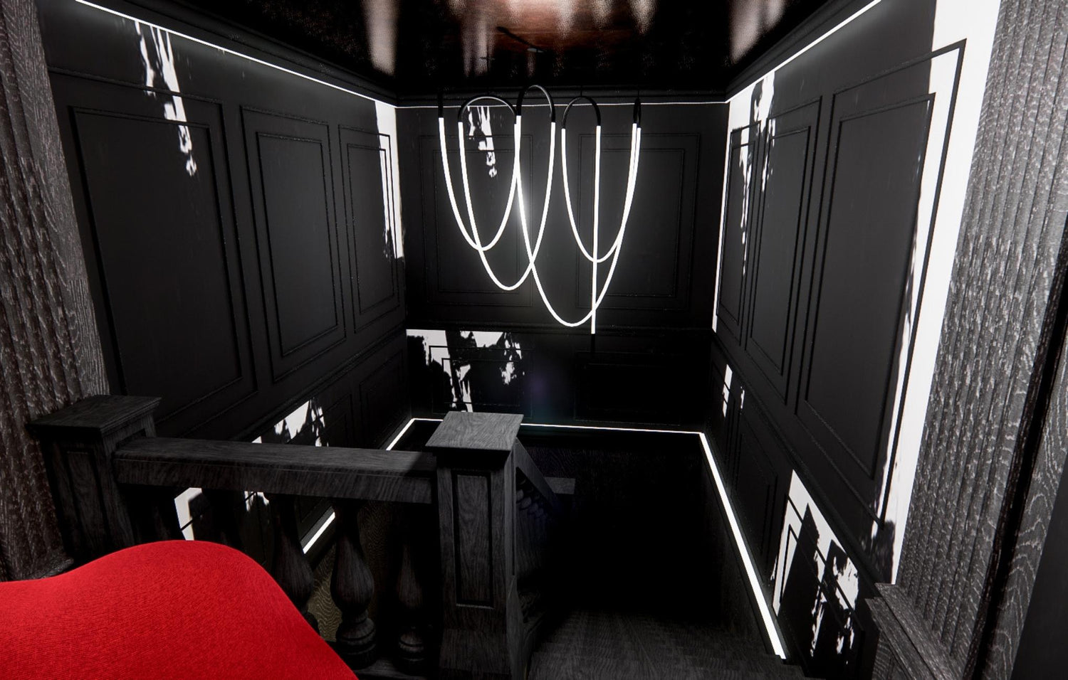 Modern black interior with LED lights and a red armchair.