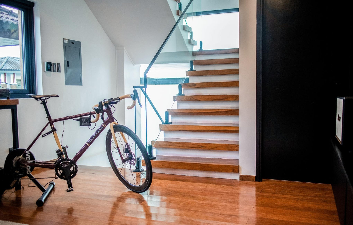 A bike is parked beside a staircase, showcasing a peaceful moment in an urban setting. 