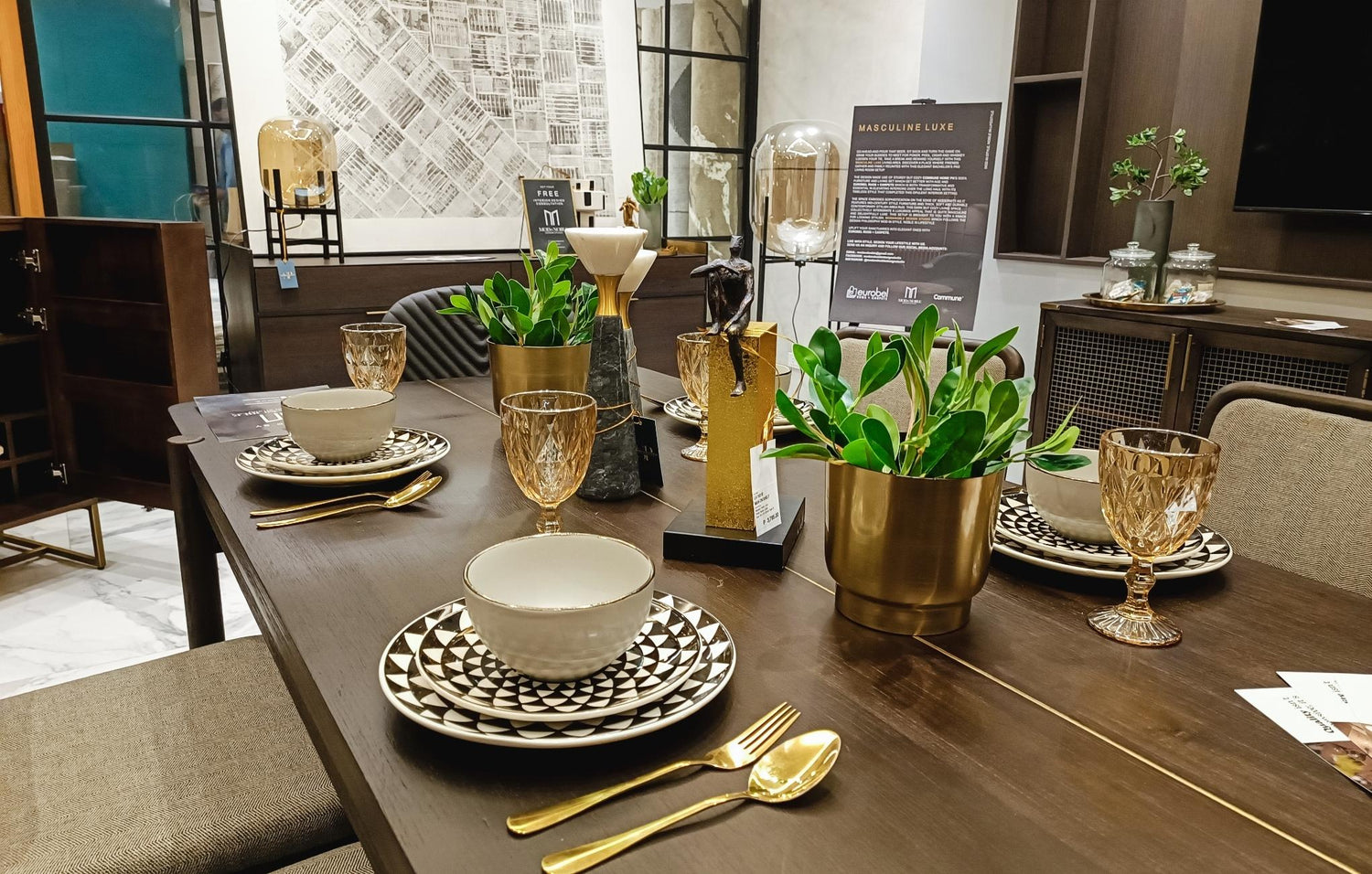 A stylish dining room table featuring elegant gold and black accents, creating a modern and sophisticated atmosphere.
