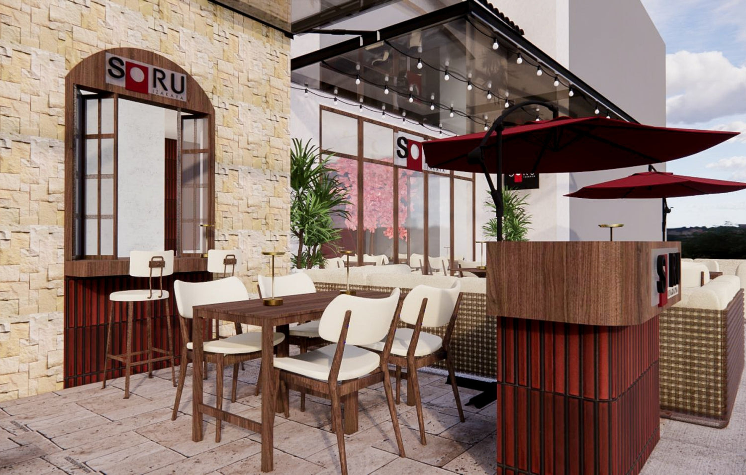 Outdoor patio dining area of a restaurant called SORU, with tables, chairs, and red umbrellas.