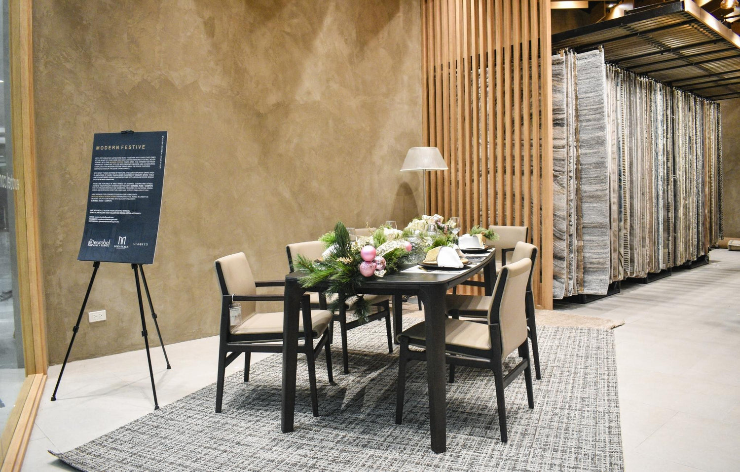  A charming table surrounded by four chairs, featuring a lovely flower arrangement that adds a touch of elegance.