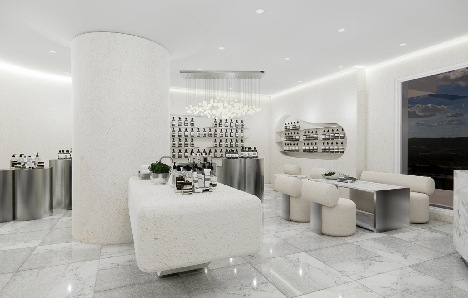 A white marble counter reflects a large mirror, creating a bright and elegant space.
