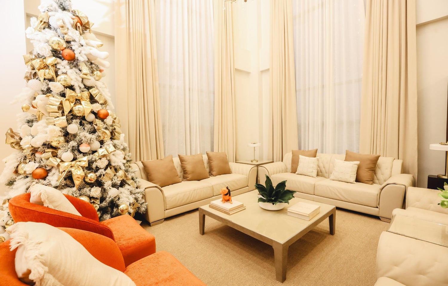 Stylish living room showcasing a blend of orange and white decor, offering a fresh and lively ambiance.