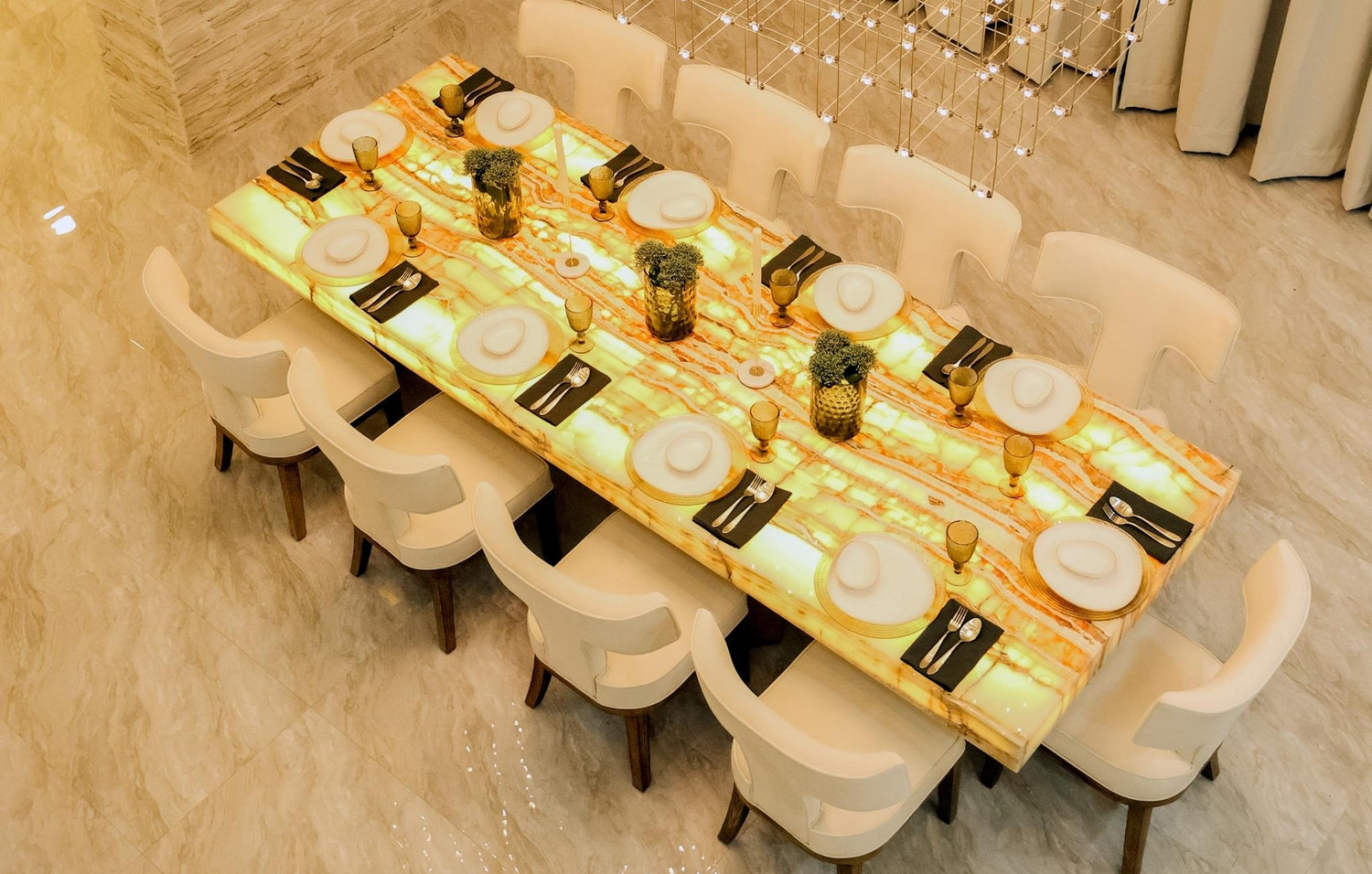  Elegant dining room showcasing a polished marble table with matching chairs, creating a sophisticated atmosphere.
