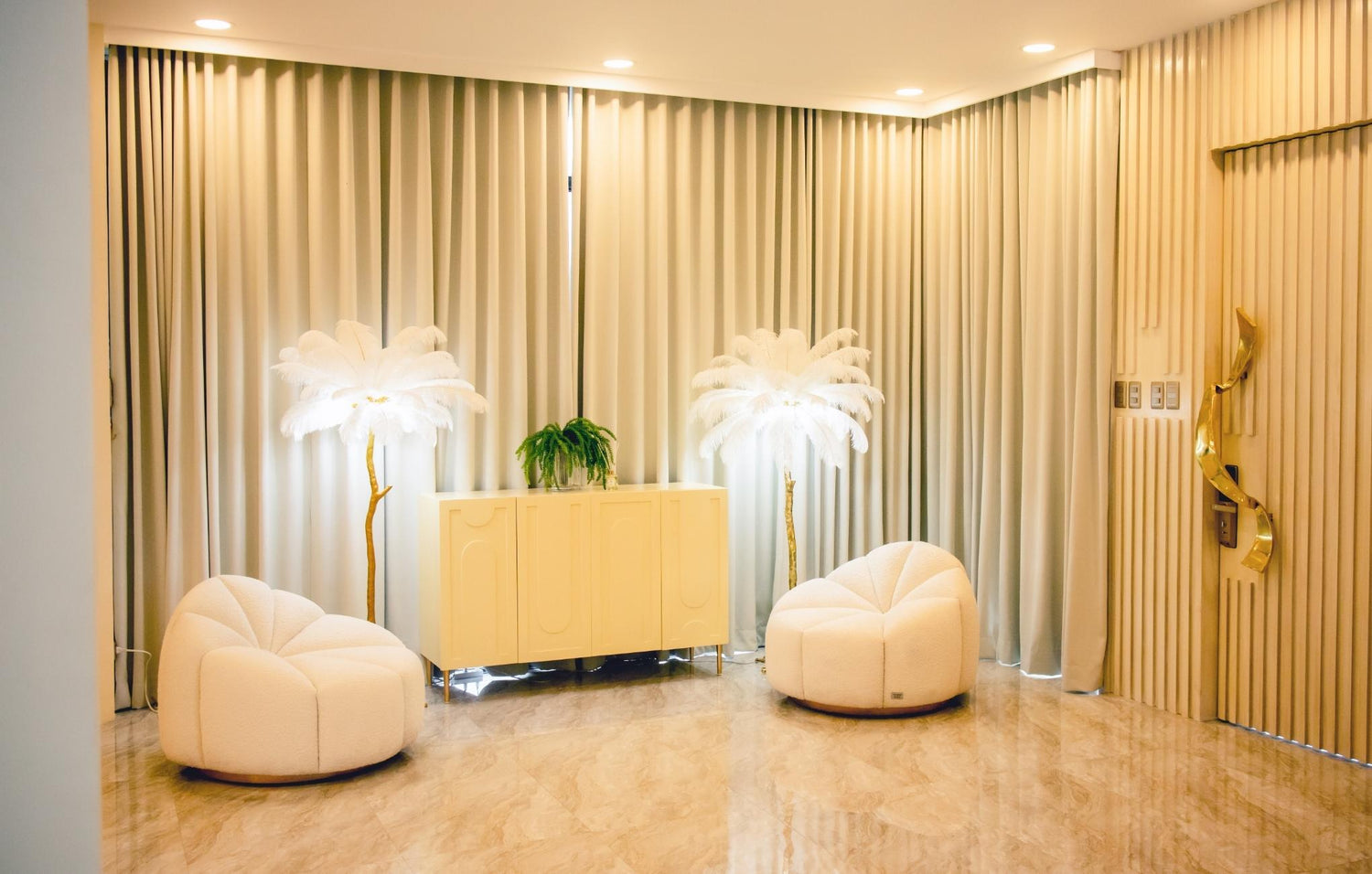 A clean white room with two simple chairs and a potted plant, emphasizing a fresh and airy design.